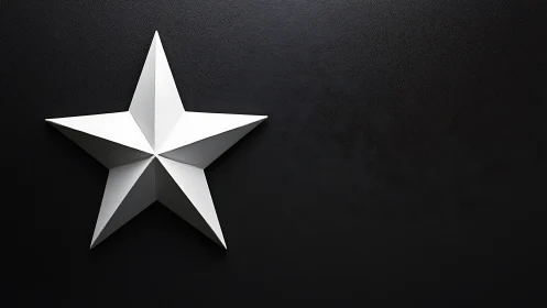Geometric white relief star on textured black substrate wall.