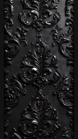 Black baroque ornamental relief pattern on matte wall surface.