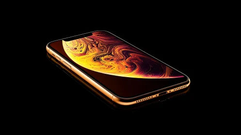 Gold iPhone XS displaying abstract liquid swirl screensaver design
