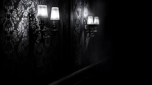Soft wall sconces casting gentle light in a dark hallway.