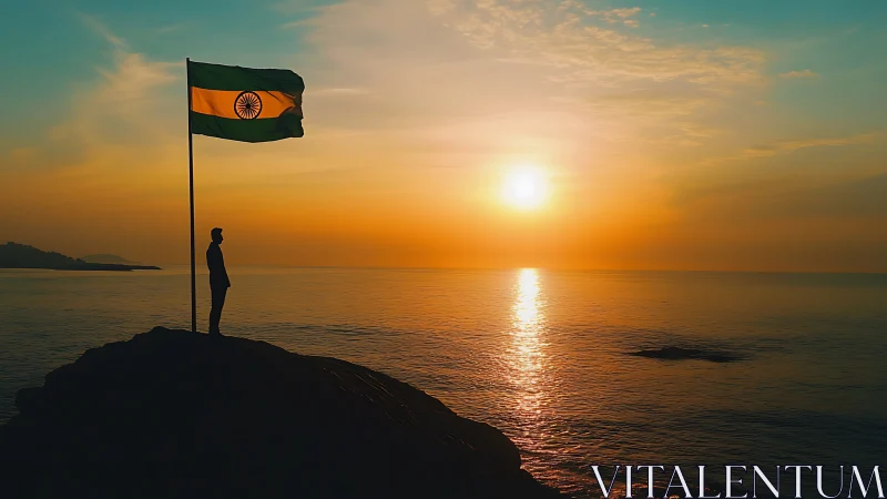 Silhouette honors Indian flag over glowing ocean sunset.