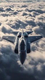 Stealth military jet flying above dense cloud layer.
