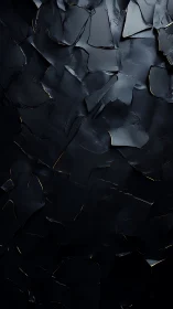 Dark fractured surface texture shows layered angular shards