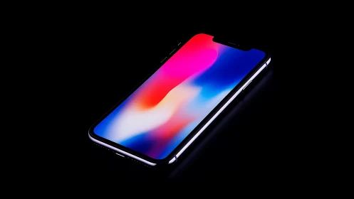 Smartphone displayed at oblique angle with gradient display.