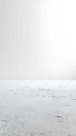 Bare white floor quietly stretches into a hazy studio horizon