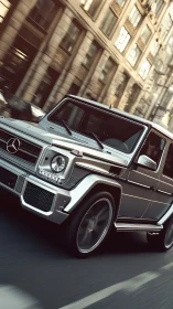 Urban dynamic rendering of silver Mercedes G-Class SUV in motion.
