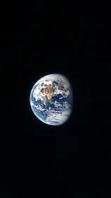 Earth is shown as a partially sunlit sphere against black space