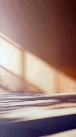 Soft morning window light casting long abstract shadows