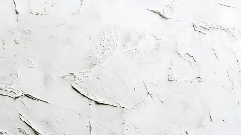 Textured white plaster wall with subtle abstract reliefs.