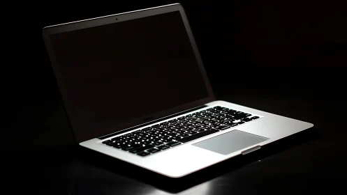 Sleek silver laptop rests ready for focused, creative work