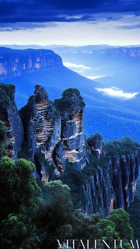 Layered sandstone cliffs above forested valley at dusk.