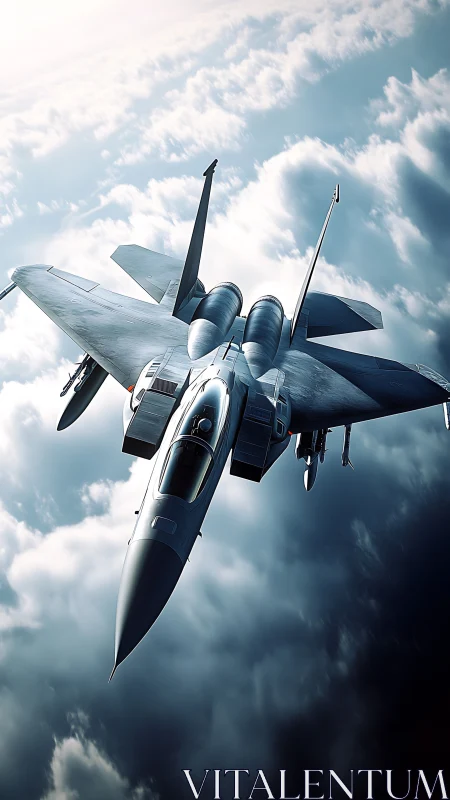 Modern gray fighter jet flying above bright layered clouds.