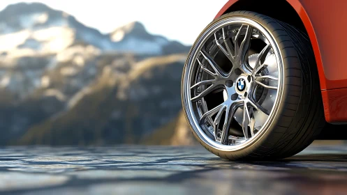 Chrome spokes daydream beside mountains while rubber hums