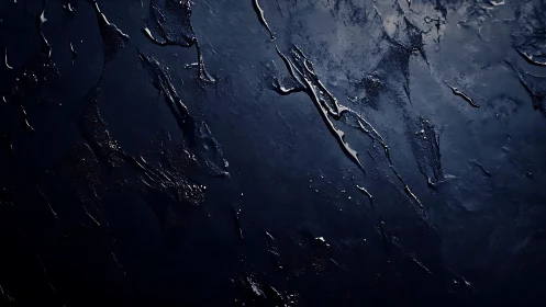 Dark Abstract Textured Surface With Metallic Blue Highlights.