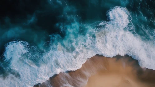 Overhead ocean surf crashes onto smooth empty shoreline