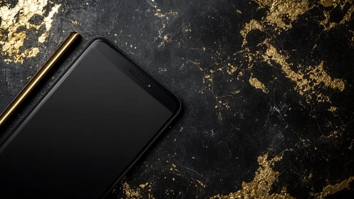 Luxury Smartphone and Stylus on Textured Black Surface with Gold Foil Accents