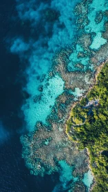Aerial Coastal Transition. Rocky Shoreline Meets Deep Ocean.