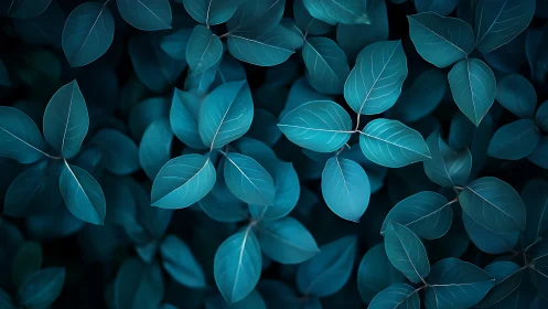 Teal foliage glows softly in moody abstract forest pattern.