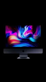 Desktop monitor displays neon fluid gradient on black background.