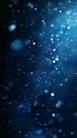 Blue bokeh particles drift through dark abstract space