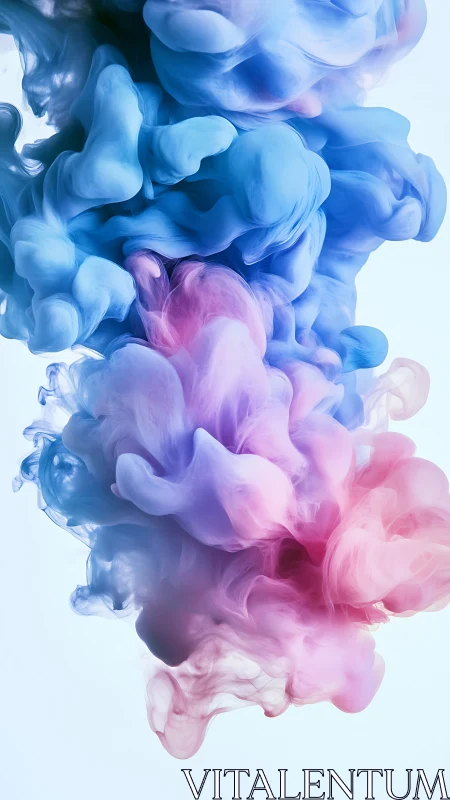 Colored ink clouds suspended in liquid against light backdrop.