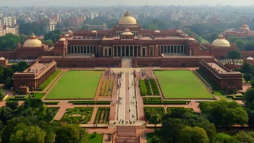 Sunlit government complex framed by lush city gardens.