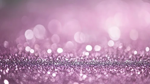 Pink glitter horizon shimmering in dreamy bokeh haze.