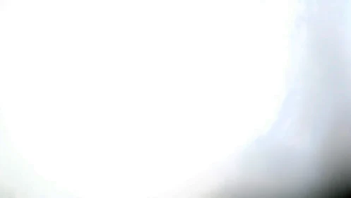 Soft glowing light washes the frame in gentle white haze.