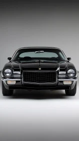 Muscular classic black coupe stands proud in clean studio light