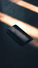 Black Smartphone in Golden Sunlight.