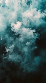 Dense teal smoke clouds forming abstract vertical column.