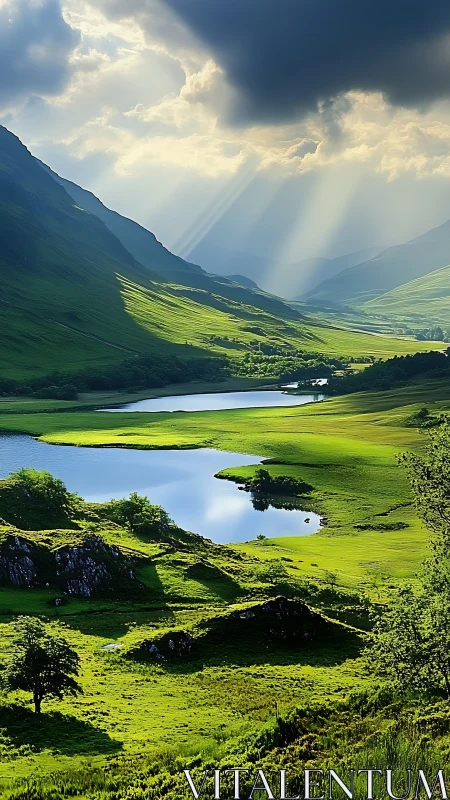 Sunbeams intersect a green valley with lakes and hills