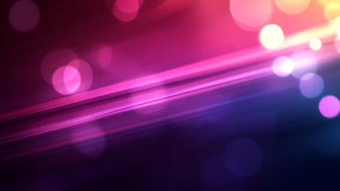 Vibrant abstract light streaks with bokeh in purple and blue tones.