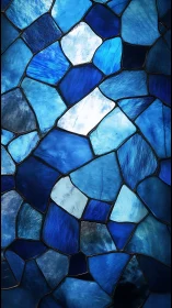 Shimmering blue stained glass mosaic under cool backlight.
