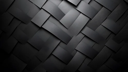 Interlaced matte black strips form a woven geometric surface