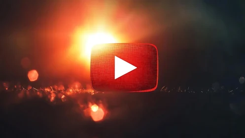 Glowing play button icon over cinematic bokeh background.