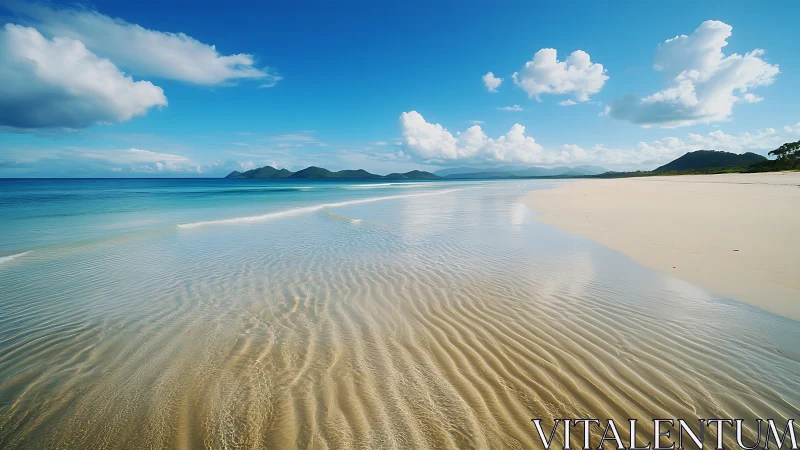 Pristine tropical beach with turquoise waters and mountain views