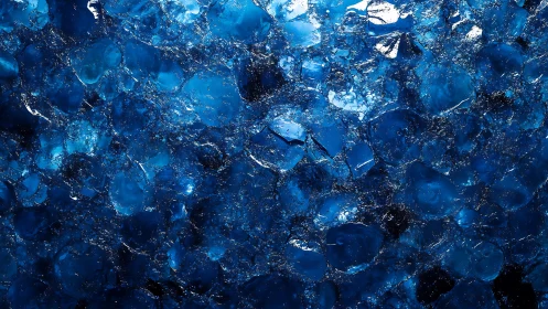 Blue crystalline macro texture with fractured highlights.