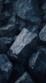 Dark angular rocks in close-up arrangement.