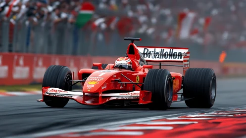 Red Formula 1 car attacking corner on packed grandstand circuit.