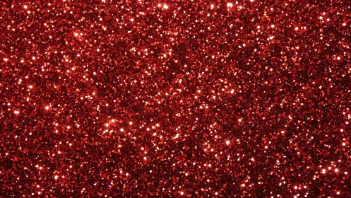 Dense red glitter texture fills frame with reflective sparkle