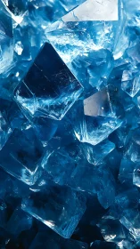 Blue crystalline ice shards catch hard studio backlight.