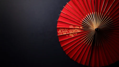Red paper parasol radiating quiet elegance and warmth.