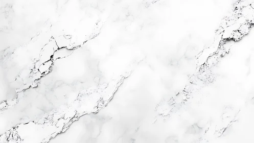 White marble surface shows fine grey veining and fracture lines