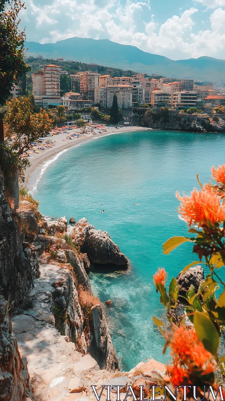 Coastal bay with rocky path, beach and midrise buildings.