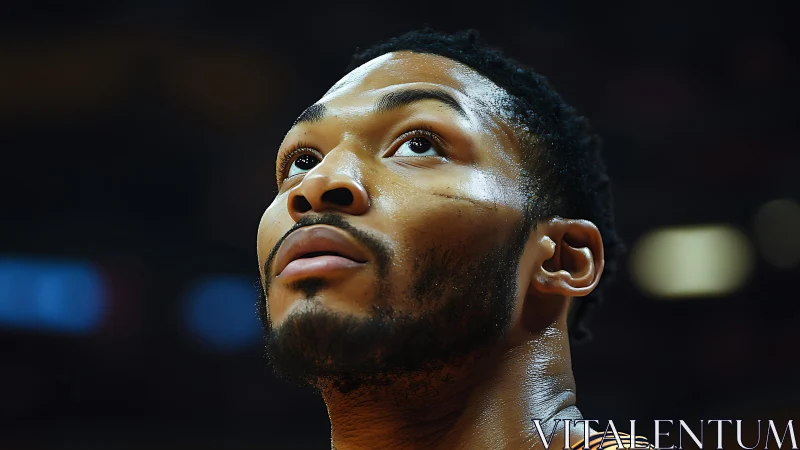 Focused basketball player looks upward with quiet determination