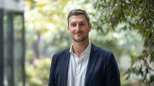 Business professional in shallow depth-of-field outdoor corporate portrait