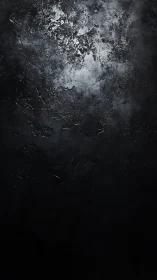 Dark textured concrete surface with subtle metallic sheen.