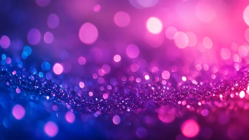 Vibrant Abstract Glitter Bokeh Background in Pink and Blue Tones.