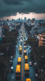 Stormy city avenue channels yellow buses through dense traffic